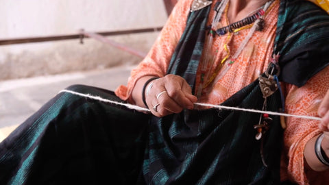spinning wool thread by hand ethical clothing