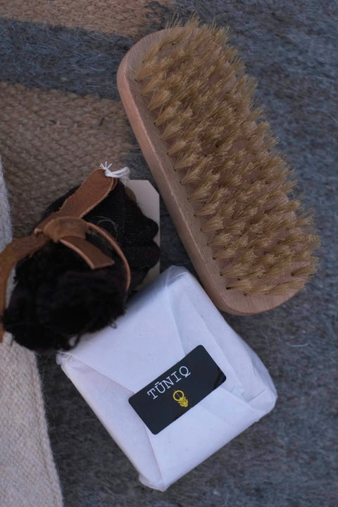 Handmade olive oil soap to hand-wash delicate wool items Wooden brush with natural bristles to de-pill and clean your garments Organic Incense to smoke over wool, protect it, and repel moths Short printed guide to Indigenous Wool Care