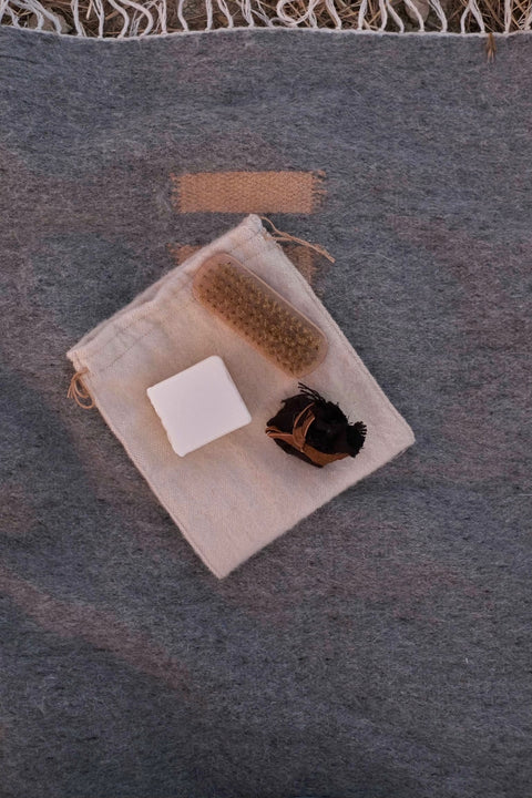 Handmade olive oil soap to hand-wash delicate wool items Wooden brush with natural bristles to de-pill and clean your garments Organic Incense to smoke over wool, protect it, and repel moths Short printed guide to Indigenous Wool Care
